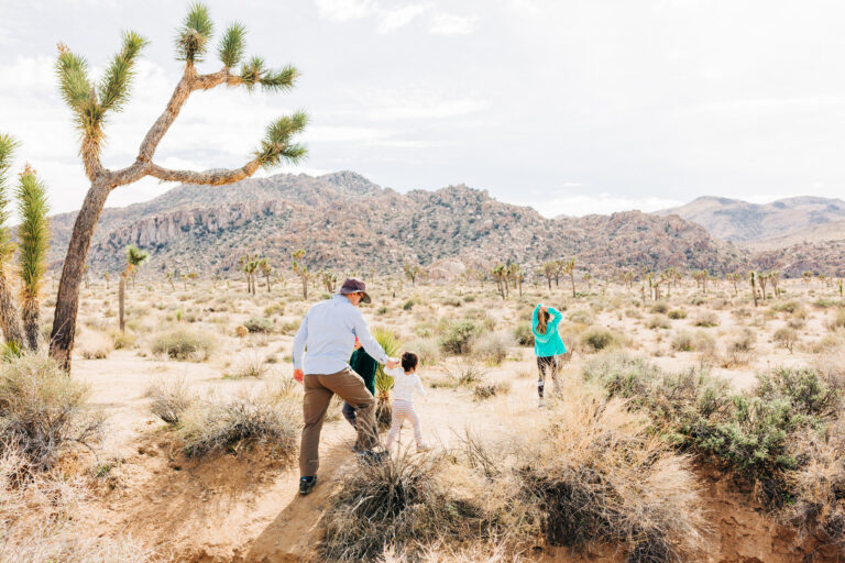 Father and Children Hiking in Desert Landscape